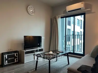 Modern living room with sleek furniture and large window view