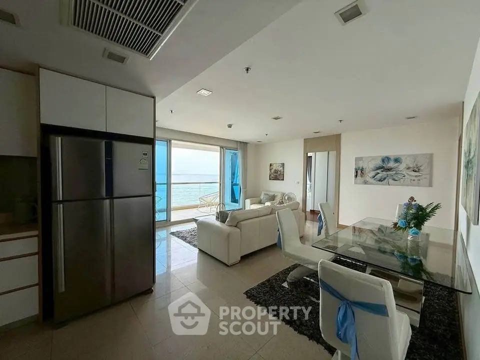 Luxurious open-plan living room with ocean view and modern decor