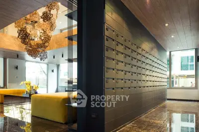 Luxurious apartment lobby with modern mailboxes and elegant decor