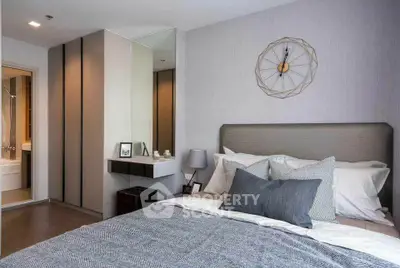 Modern bedroom with stylish decor and ensuite bathroom