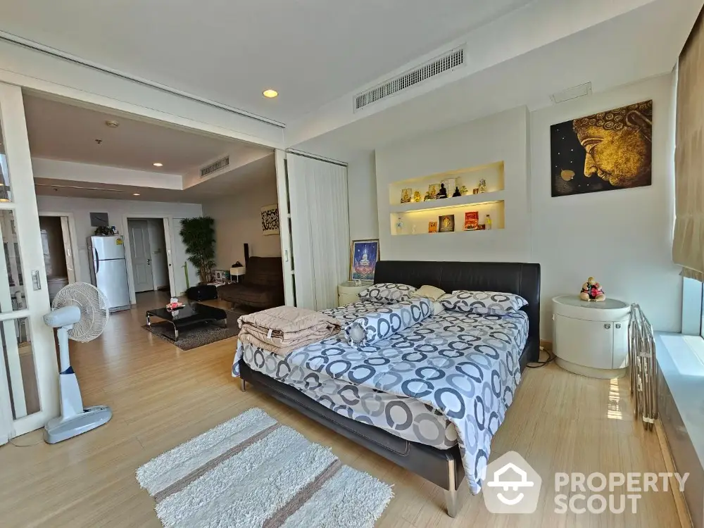 Spacious bedroom with modern decor and open layout in luxury apartment