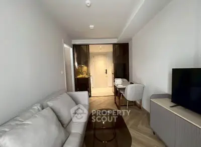 Modern living room with sleek furniture and stylish decor in a contemporary apartment.