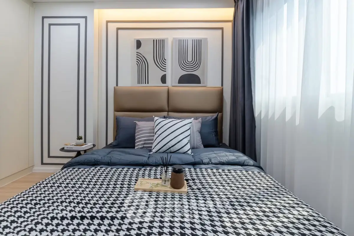 Modern bedroom with stylish decor and natural light