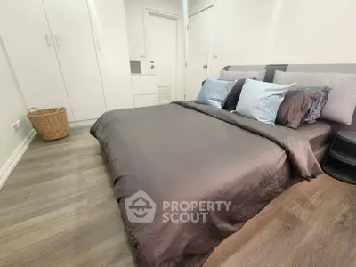 Modern bedroom with stylish decor and cozy bedding