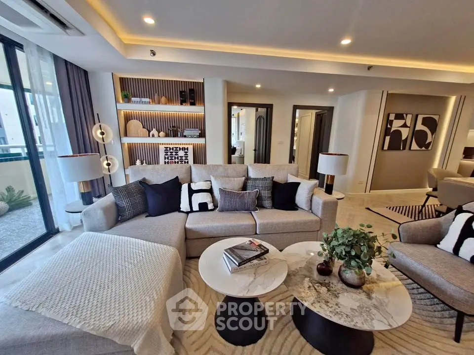 Luxurious modern living room with stylish decor and ample natural light