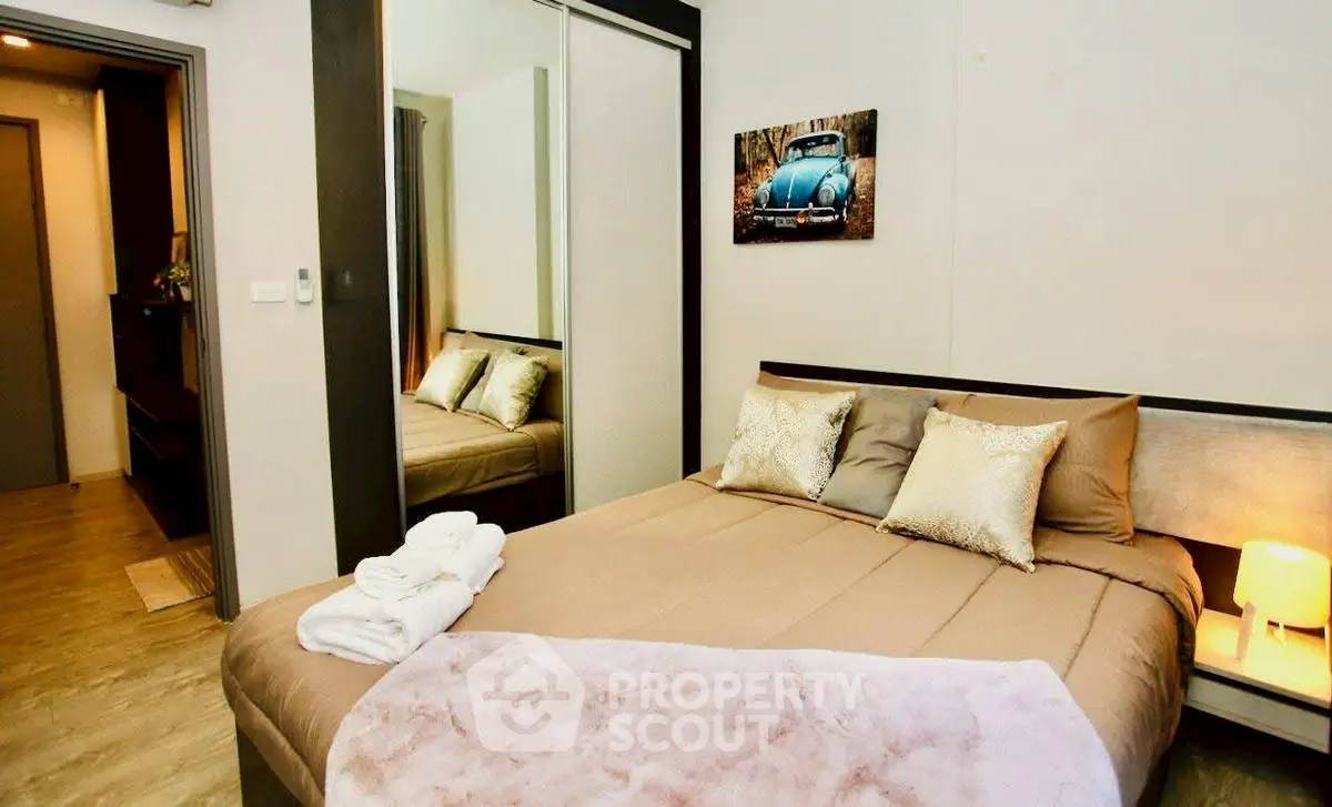 Cozy bedroom with modern decor and mirrored wardrobe