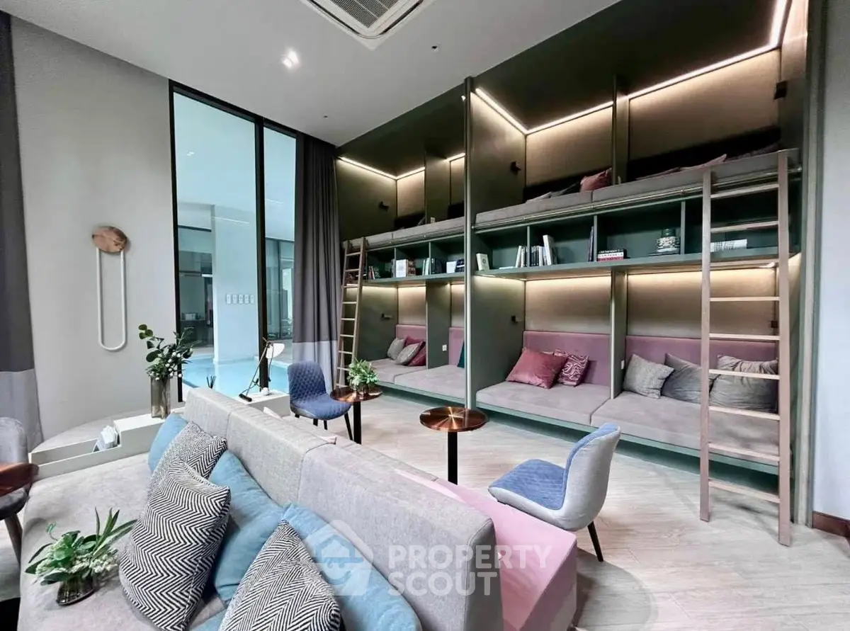 Modern co-living space with stylish bunk beds and cozy seating area, perfect for urban living.