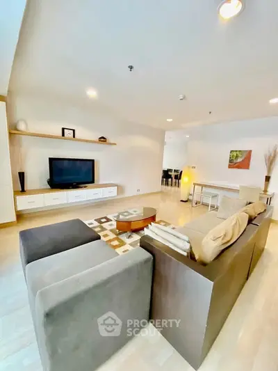 Spacious modern living room with stylish furniture and open layout