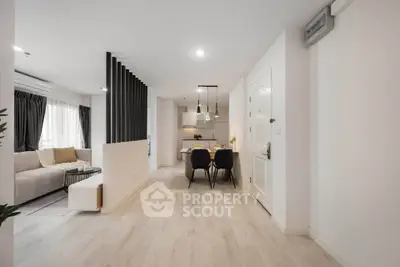 Modern open-plan living room with dining area and stylish decor