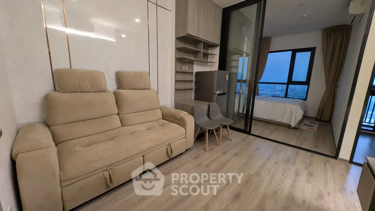 Modern apartment interior with cozy living room and bedroom view