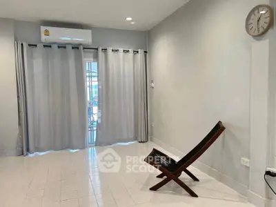 Minimalist living room with modern chair and air conditioning