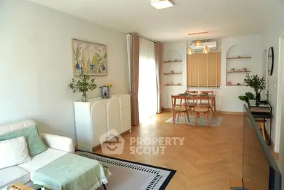 Spacious living room with elegant dining area and modern decor