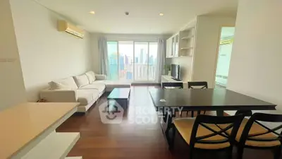 Spacious modern living room with city view and elegant dining area