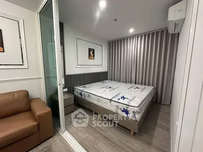 Modern bedroom with stylish decor and comfortable furnishings in a contemporary apartment.