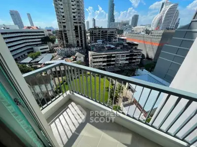 Stunning cityscape view from a modern balcony in a high-rise apartment.