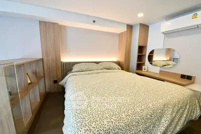 Cozy modern bedroom with stylish wooden furniture and ambient lighting