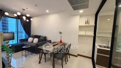 Modern living room with dining area and city view, featuring elegant decor and ample natural light.