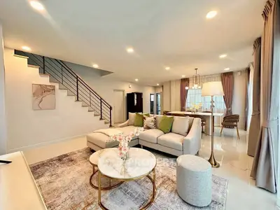 Spacious modern living room with elegant decor and open layout, perfect for entertaining.