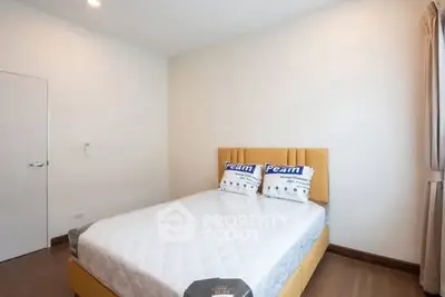 Cozy bedroom with modern furnishings and natural light