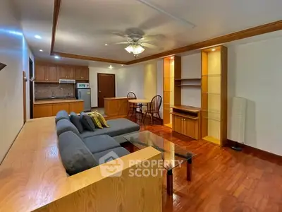 Spacious living room with modern furniture and open kitchen layout