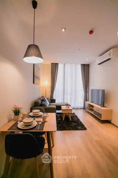 Modern living room with cozy dining area and stylish decor