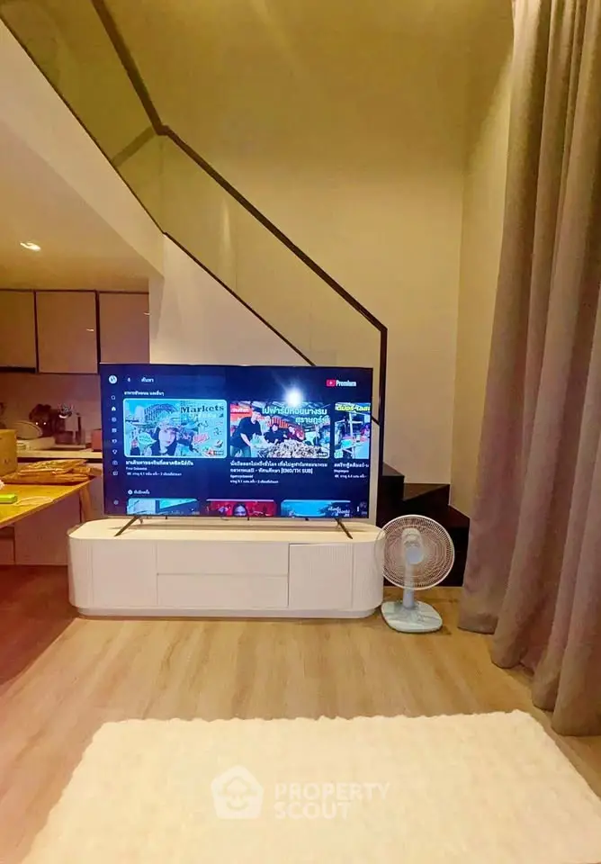 Modern living room with stylish TV setup and cozy decor