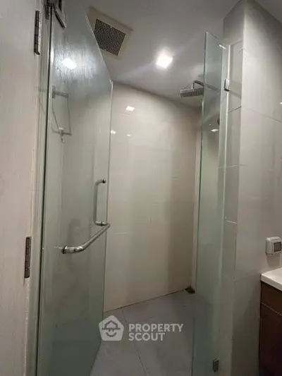 Modern bathroom with glass shower enclosure and sleek design