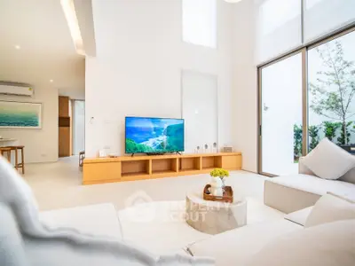Spacious modern living room with high ceilings and natural light