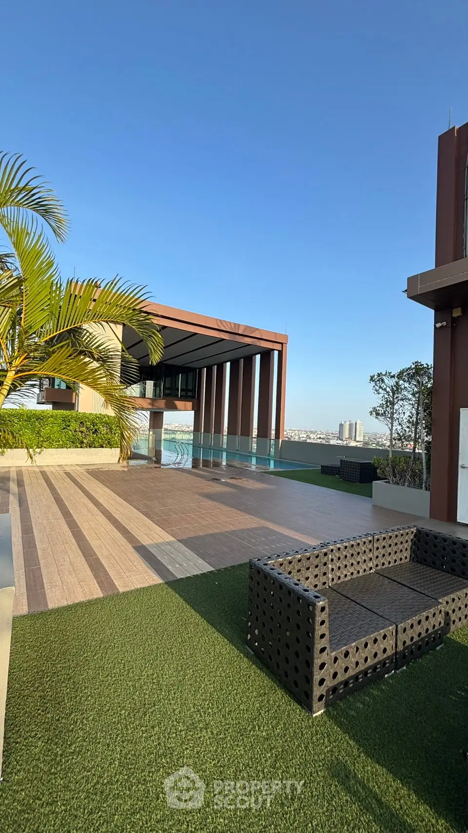 Luxurious rooftop terrace with stunning city views and modern outdoor seating.