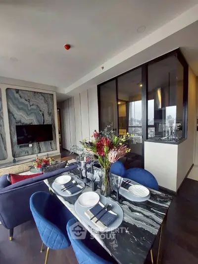 Luxurious modern living room with elegant dining area and stunning city view.