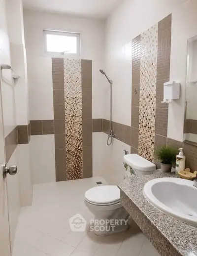 Modern bathroom with stylish tile accents and sleek fixtures