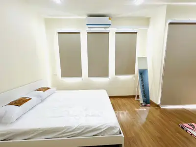 Spacious bedroom with modern minimalist design and natural light