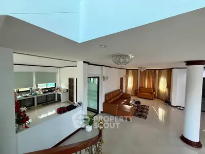 Spacious living room with elegant decor and open kitchen layout