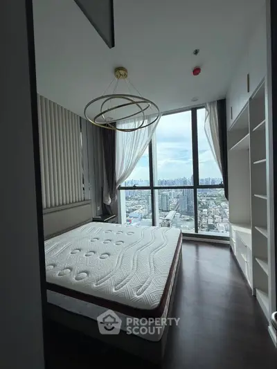 Luxurious bedroom with stunning city view and modern decor