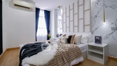 Luxurious bedroom with modern decor and cozy ambiance