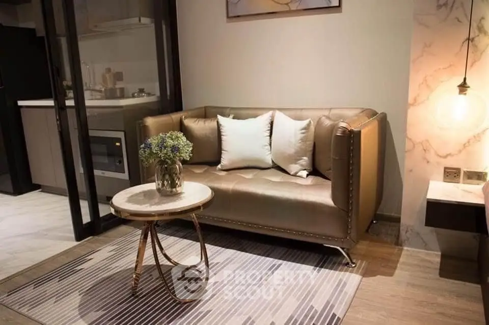 Stylish living room with elegant sofa and modern decor in a cozy apartment setting.