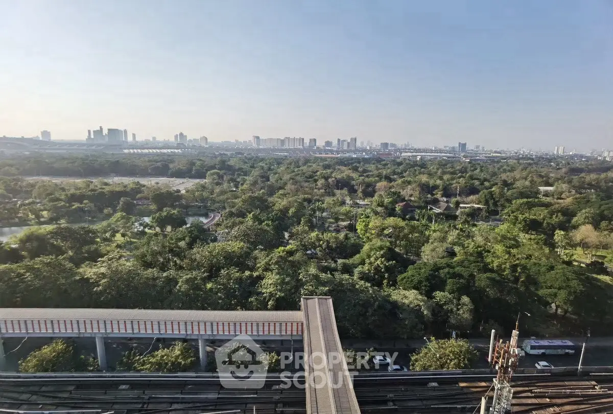 Stunning cityscape view with lush greenery and urban skyline, perfect for serene living.