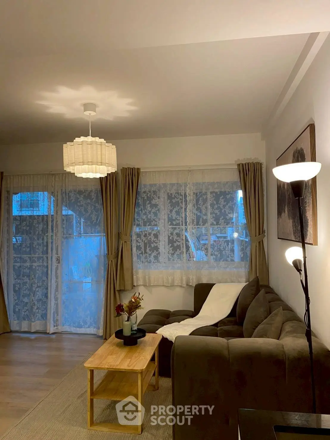 Cozy living room with stylish decor and ample natural light