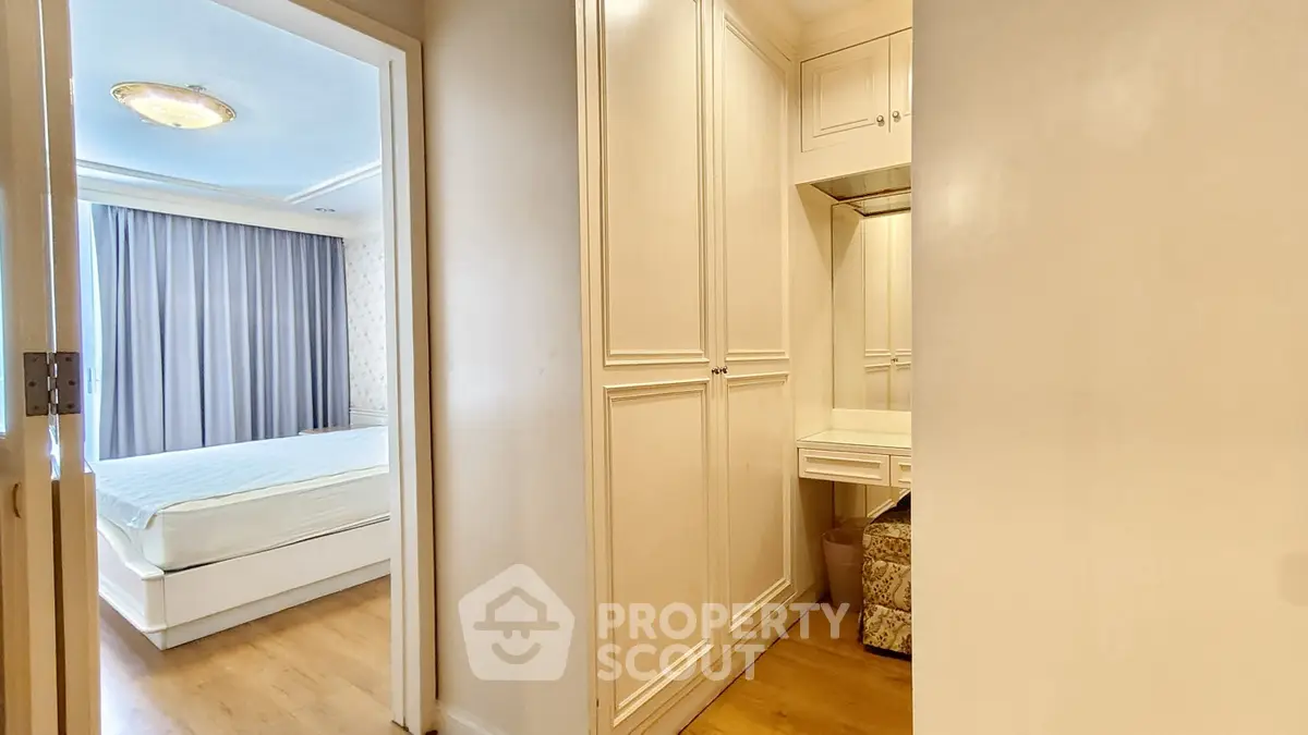 Spacious bedroom with elegant built-in wardrobe and cozy ambiance