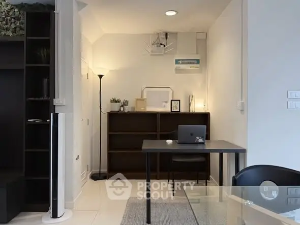 Modern study room with sleek furniture and ambient lighting, perfect for productivity and comfort.