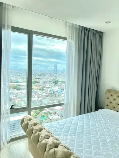 Luxurious bedroom with stunning city view from large window