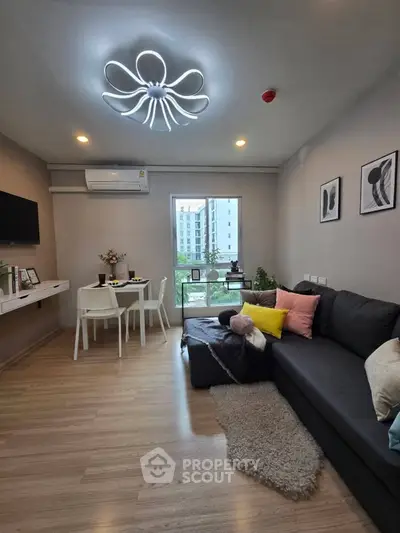 Modern living room with stylish lighting and cozy decor