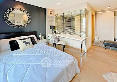 Luxurious bedroom with modern decor and stylish furnishings, featuring a cozy bed and elegant lighting.