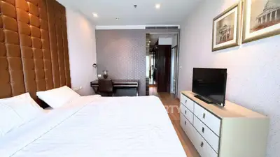 Luxurious bedroom with elegant decor and modern furnishings in a high-end apartment.