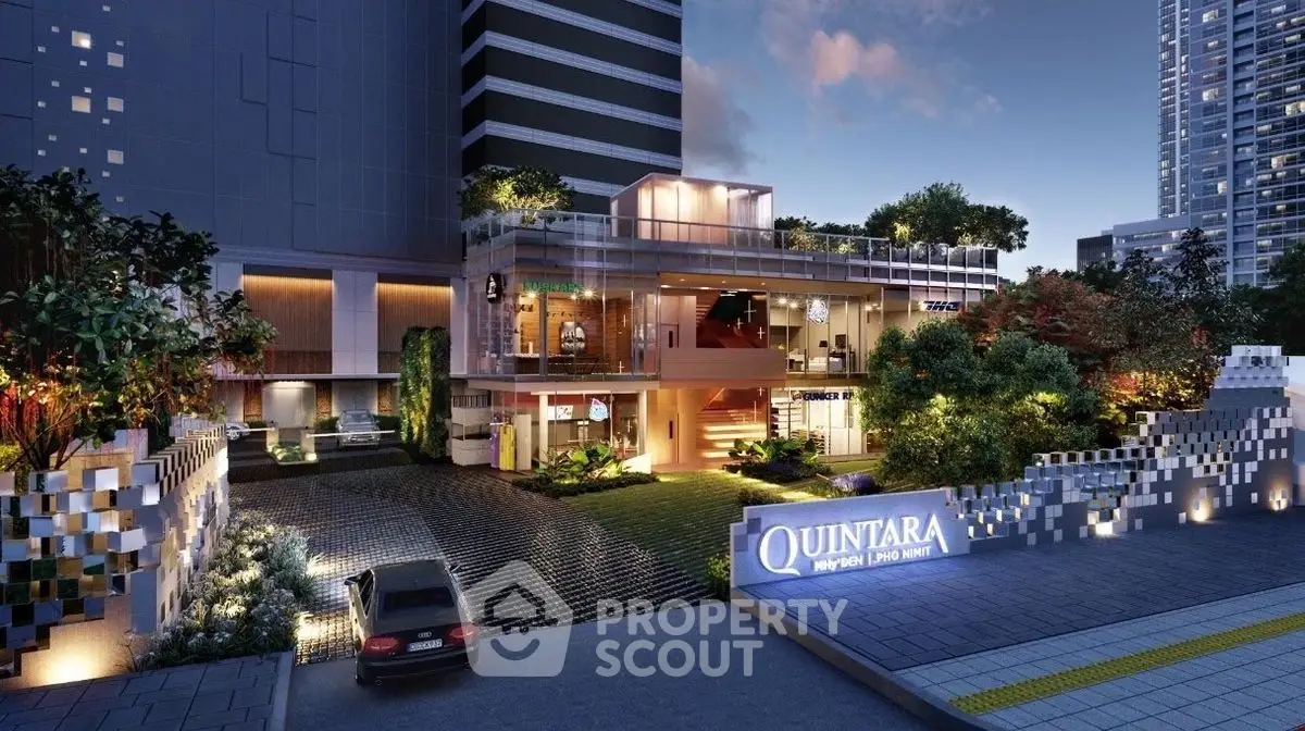 Luxurious modern building exterior with lush landscaping and elegant lighting at dusk.