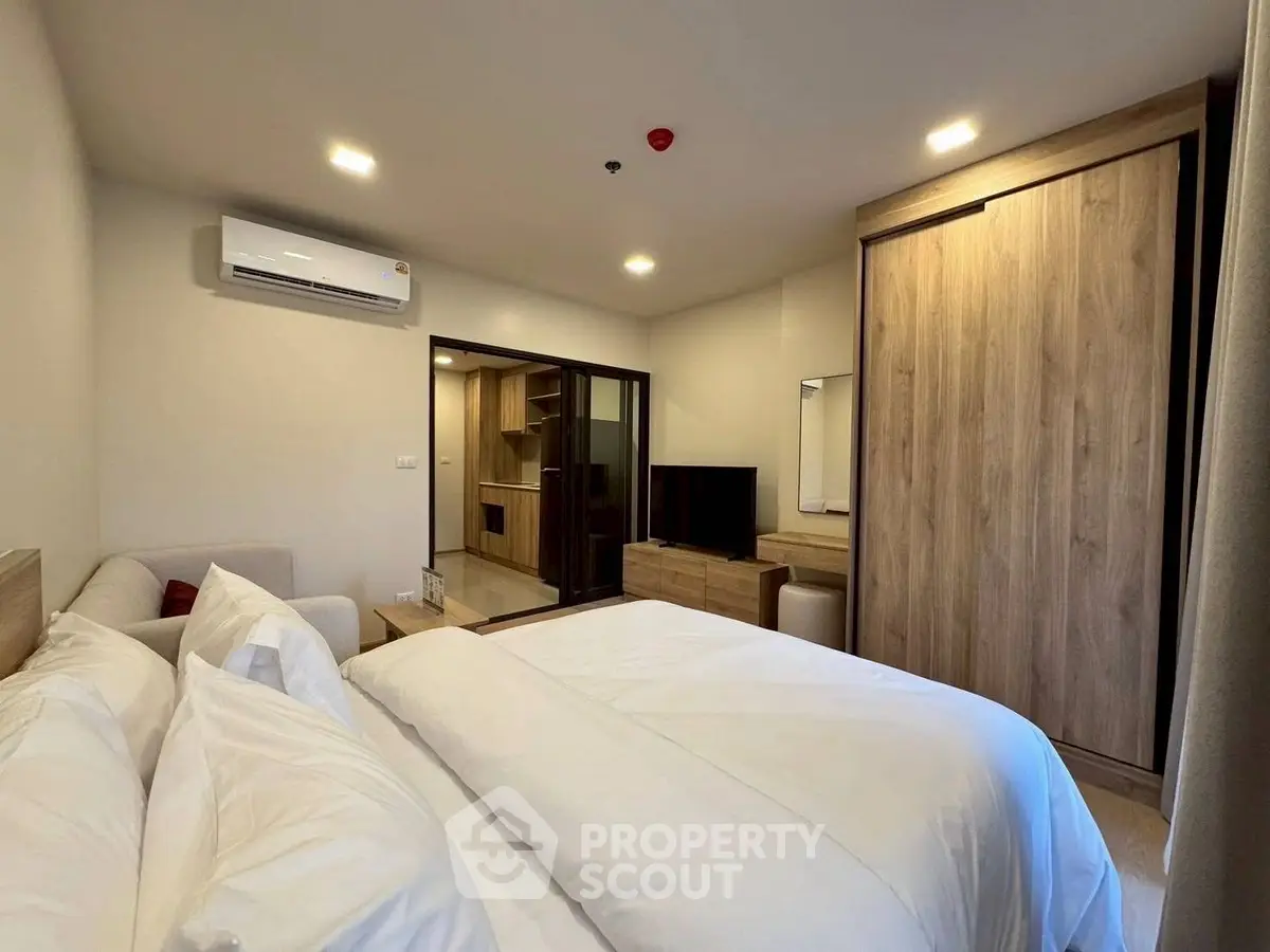 Modern bedroom with sleek wooden furniture and cozy ambiance