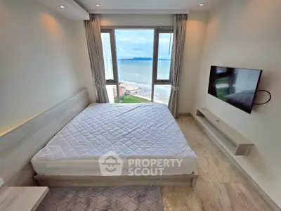 Luxurious bedroom with stunning ocean view and modern amenities