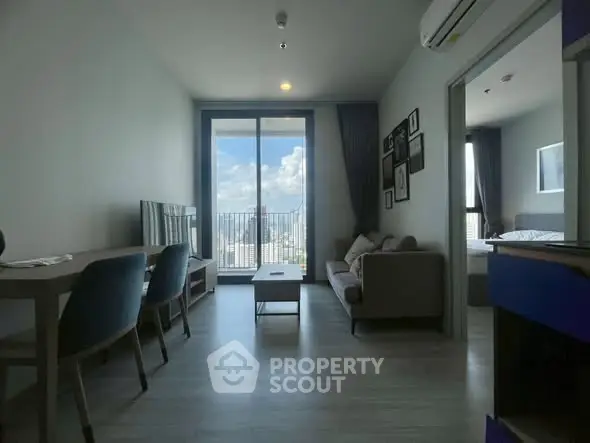 Modern living room with balcony view in high-rise apartment