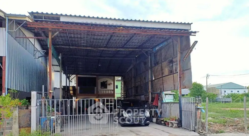 Spacious industrial-style garage with ample parking and secure gated entrance