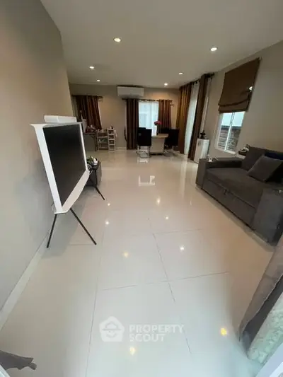 Spacious modern living room with sleek TV and elegant decor